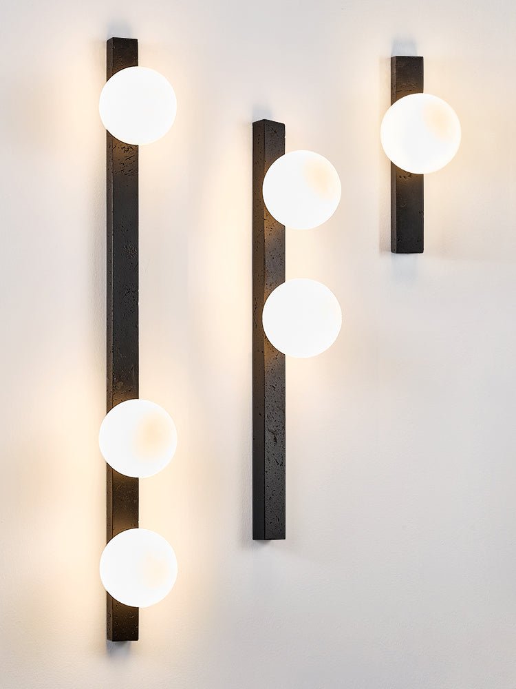 Zoshaira bollen Zwart travertin wandlamp