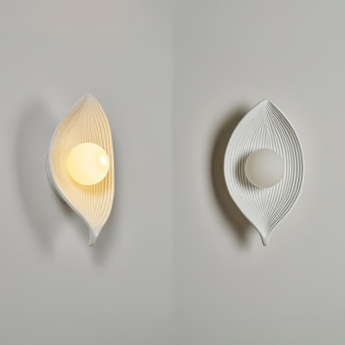 Lirixa wandlamp met bladmotief in hars en metaal