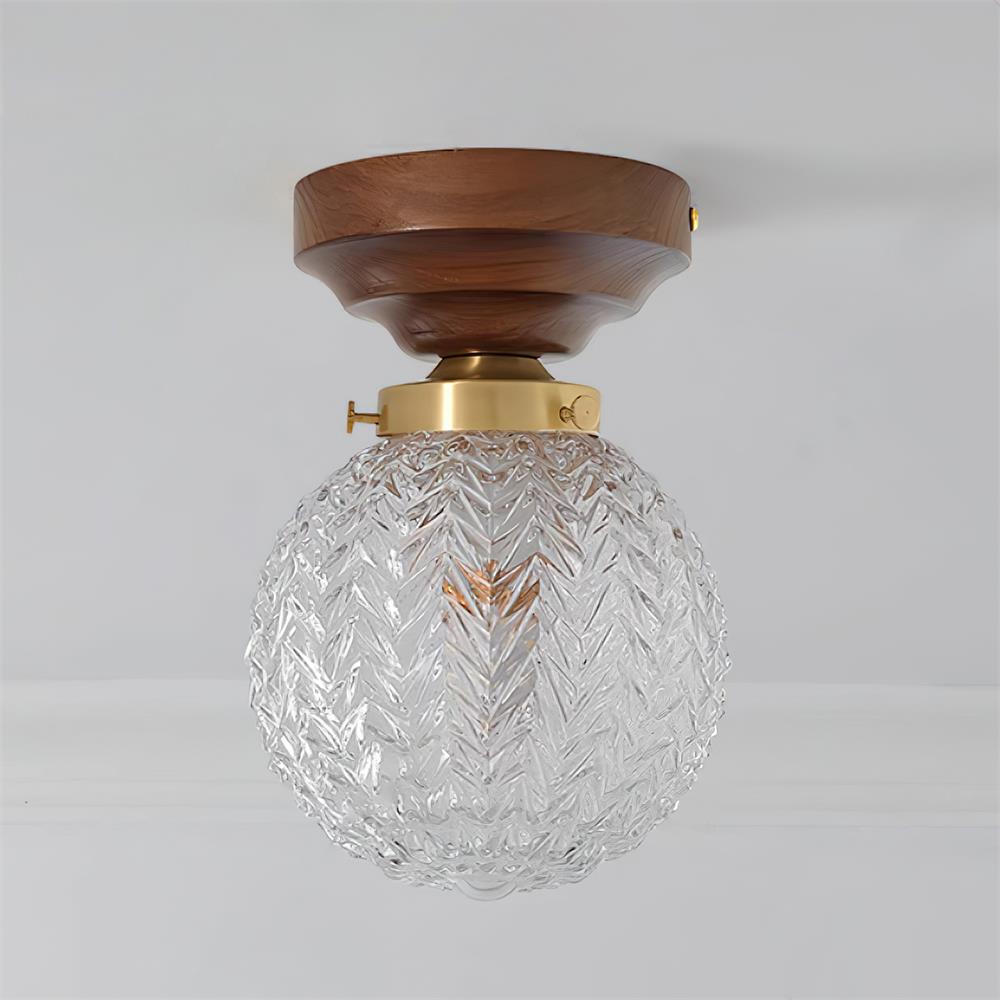 Plafondlamp met bolvormige kap van helder glas, walnoothout en messing
