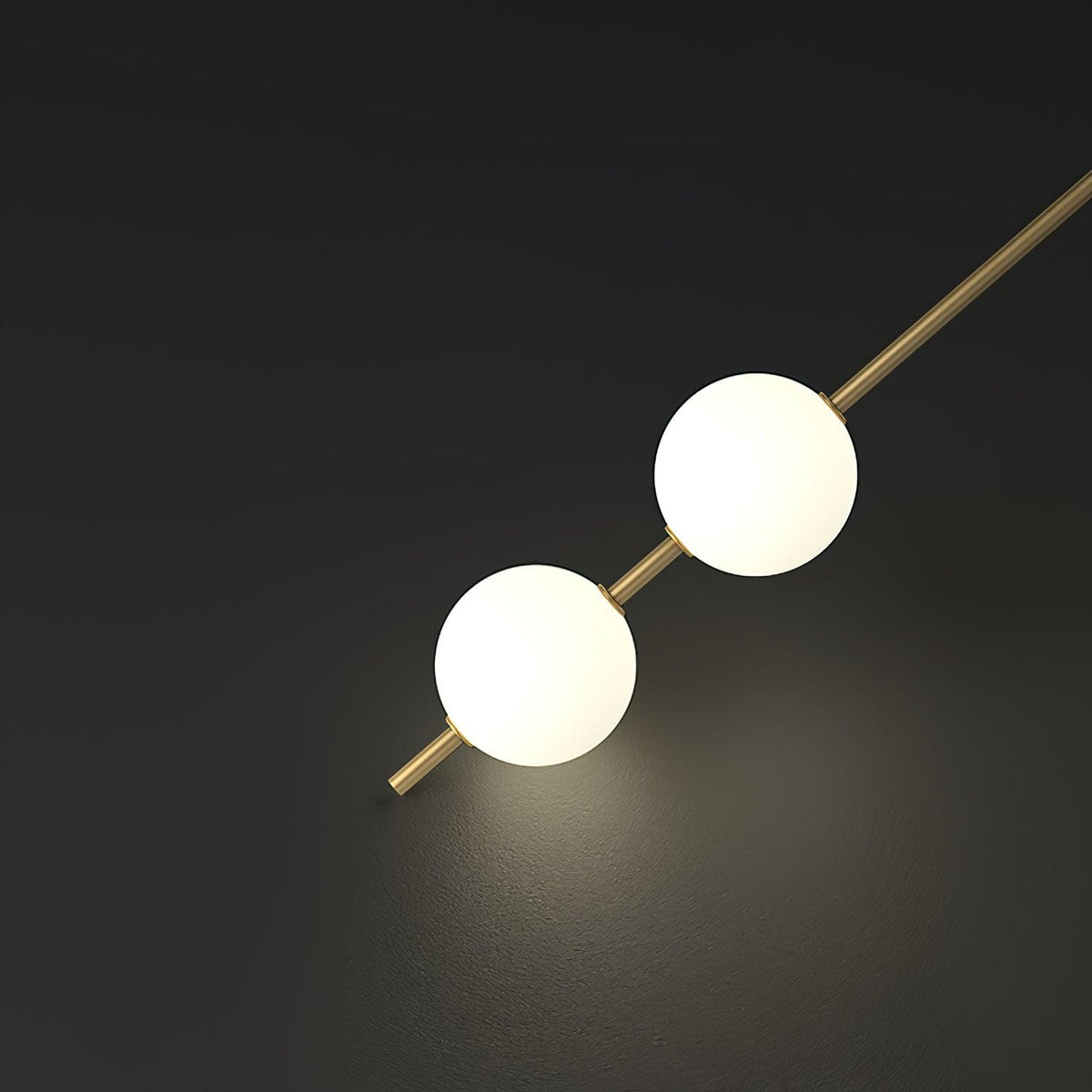 Soloiella wandlamp met verticale bollen van messing