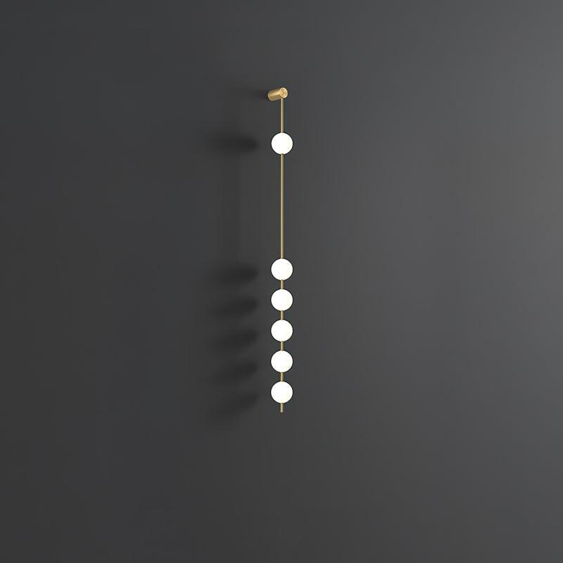 Soloiella wandlamp met verticale bollen van messing