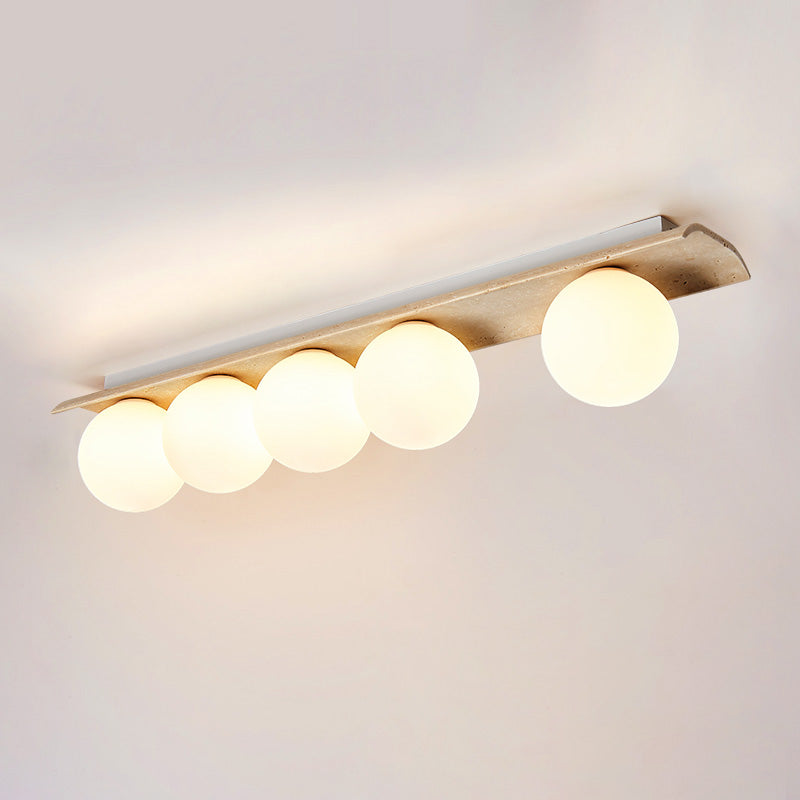 Serenaya bollen travertin glas plafondlamp