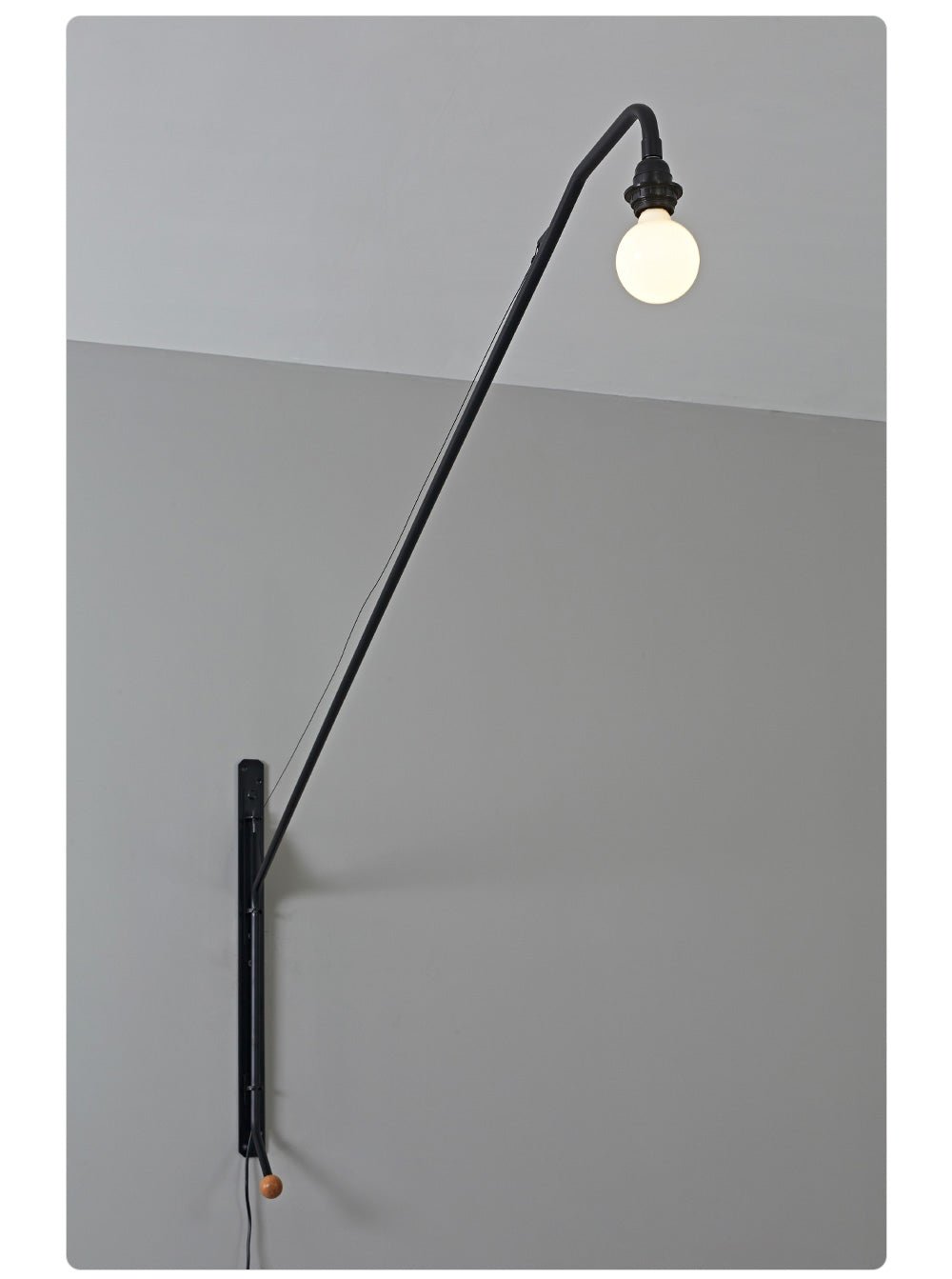 Zwarte wandlamp met lange arm