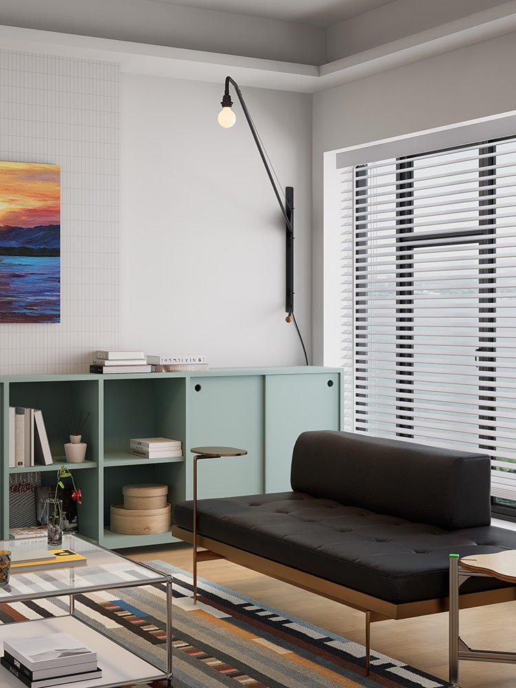 Zwarte wandlamp met lange arm