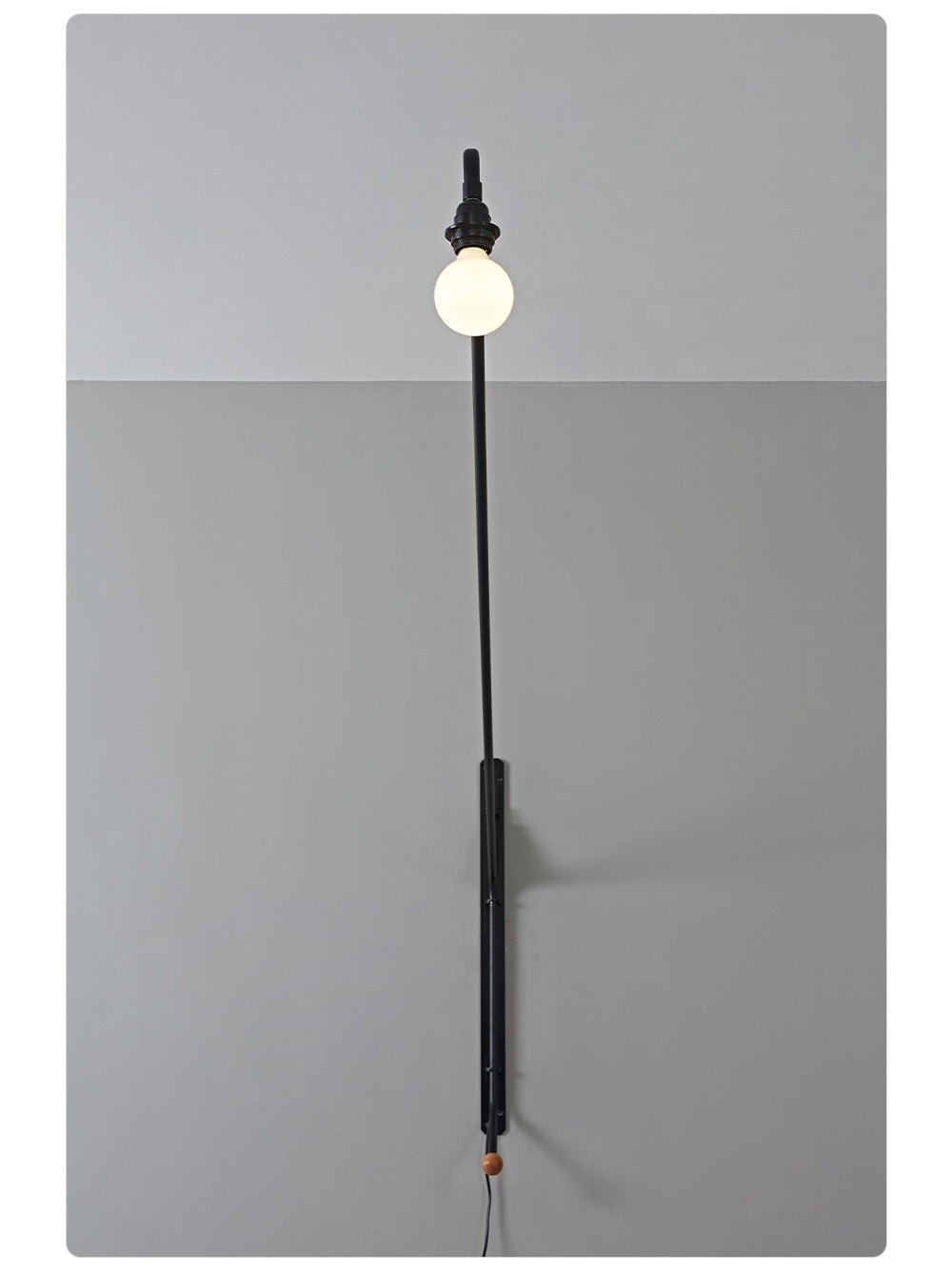 Zwarte wandlamp met lange arm