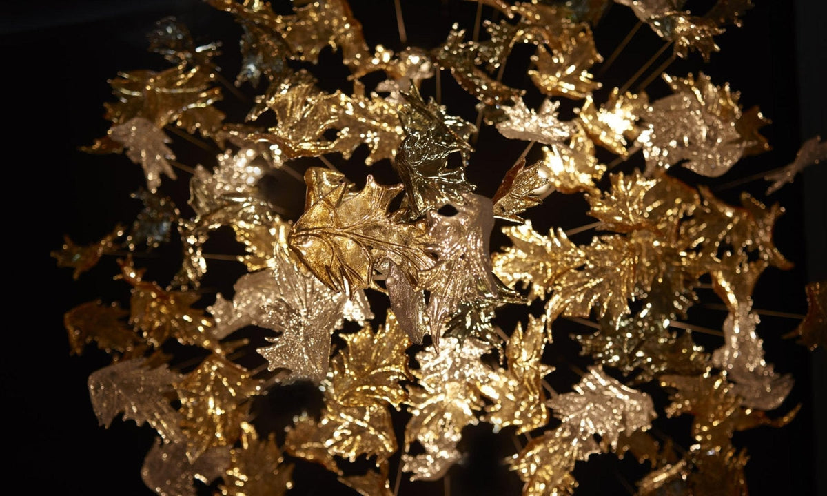Cosolion kroonluchter met vogels in amberkleurig helder glas