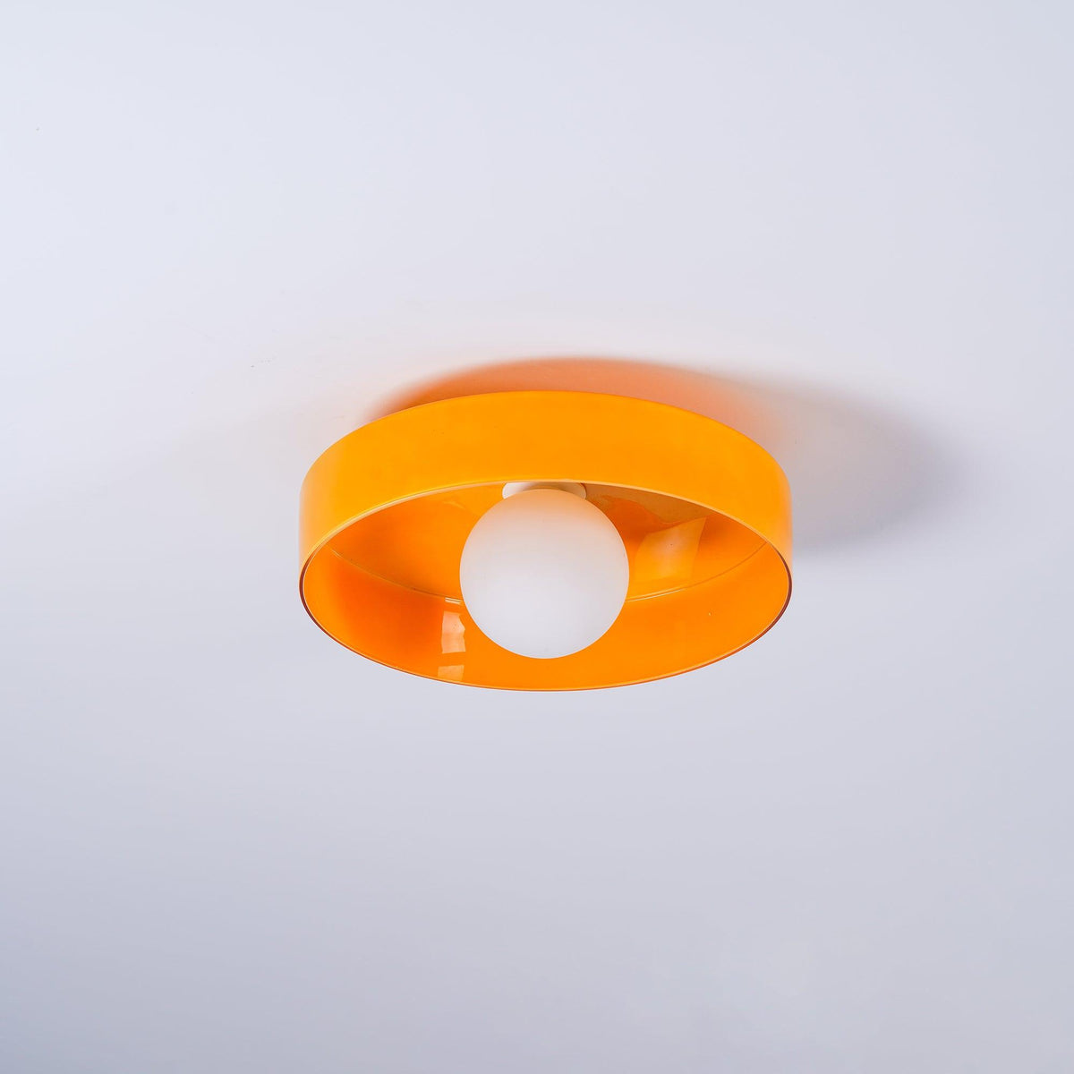 Diroxen plafondlamp oranje ring speels sculpturaal