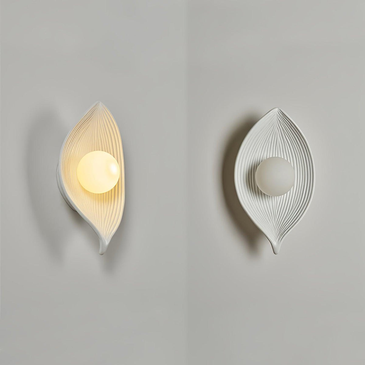 Lirixa wandlamp met bladmotief in hars en metaal