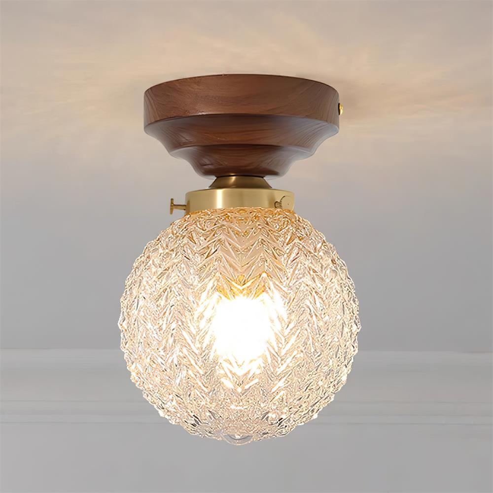 Plafondlamp met bolvormige kap van helder glas, walnoothout en messing
