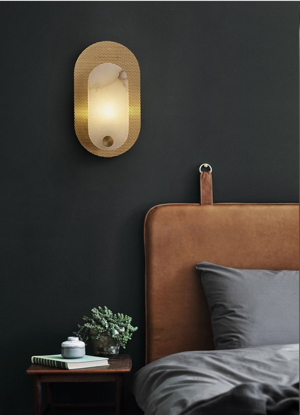 Perforated ovaal wandlamp in albast