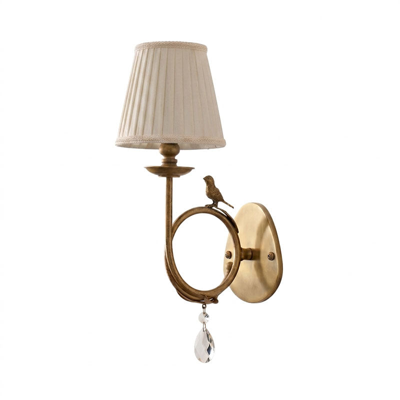 Orvienne wandlamp met stofkap in de vorm van een vogel