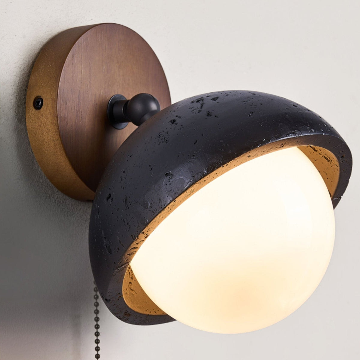 Serenaria bollen Zwart travertin Draaibaar wandlamp