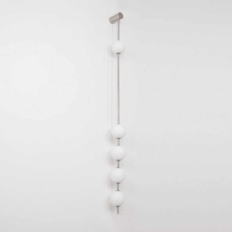Soloiella wandlamp met verticale bollen van messing