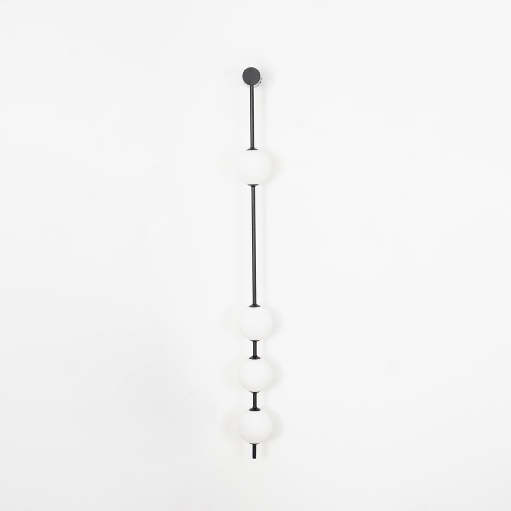 Soloiella wandlamp met verticale bollen van messing