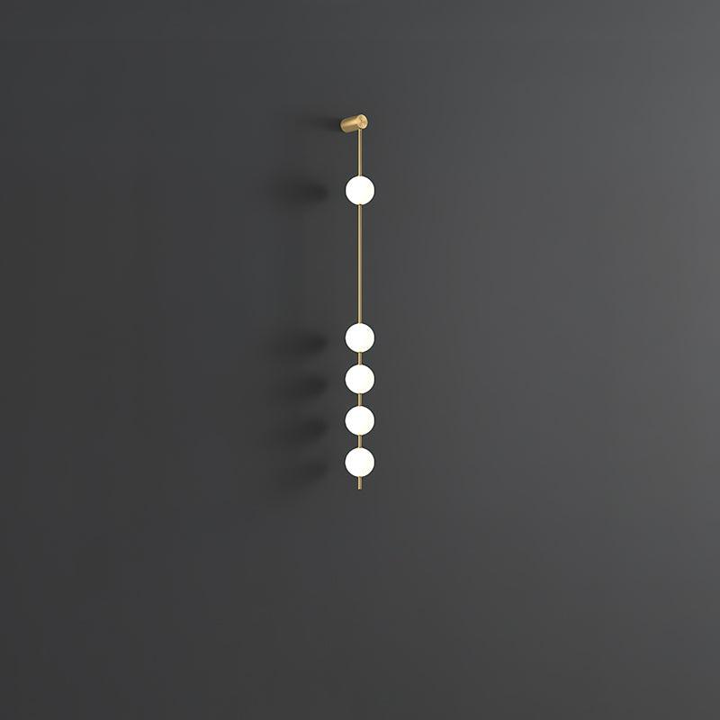 Soloiella wandlamp met verticale bollen van messing